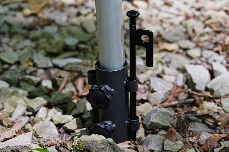 Load image into Gallery viewer, Adjustable pole base secured on gravel