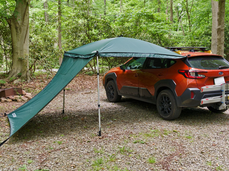 Load image into Gallery viewer, Green car awning set up beside orange SUV