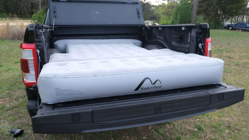 Load image into Gallery viewer, Mattress extended in the truck bed, maximizing space.