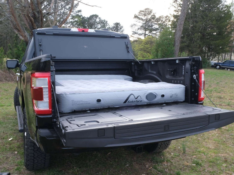 Load image into Gallery viewer, Black truck with fully installed air mattress.