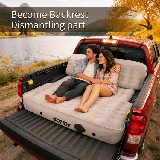 Couple relaxing on truck bed air mattress with backrest support